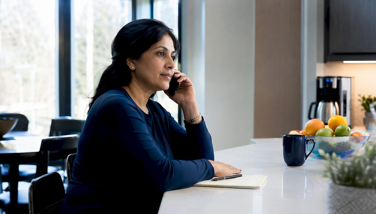 Woman scheduling mobile car detailing appointment