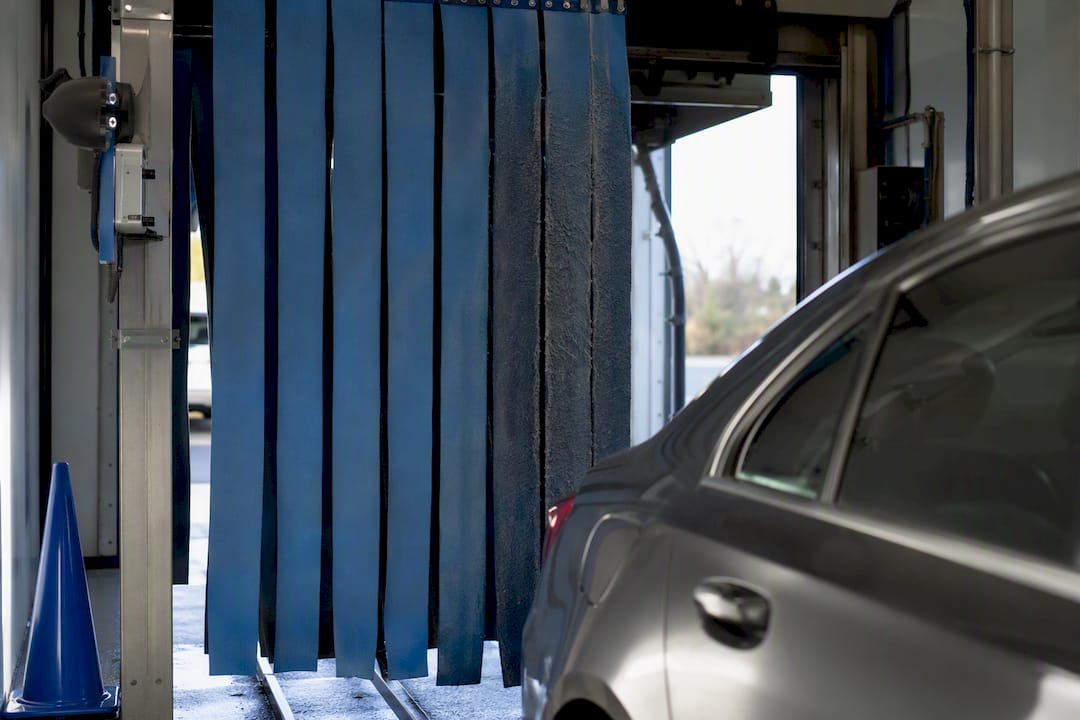 Driver inspecting automatic wash cloth strips