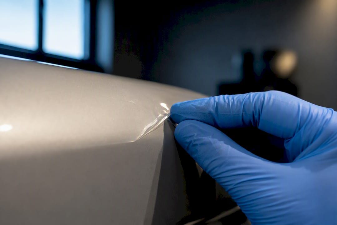 Close-up of lifted paint protection film edge