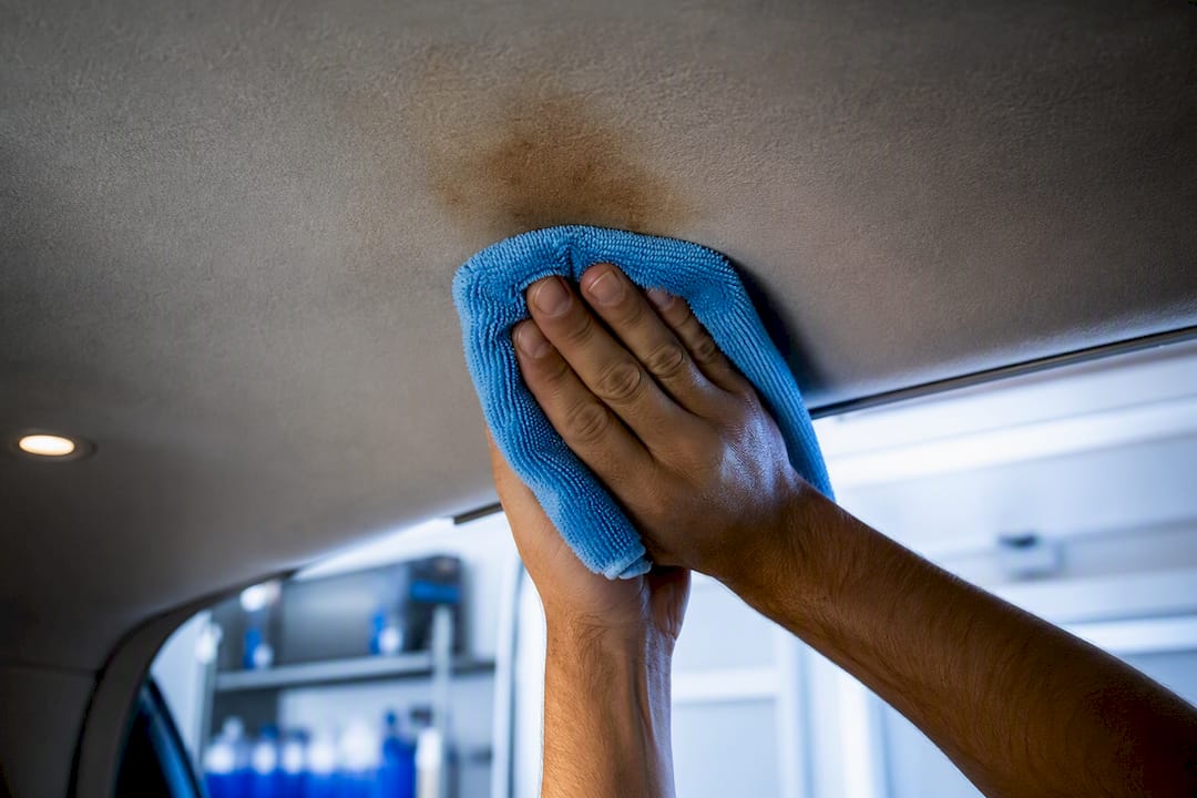 Detailer blotting stain from car headliner