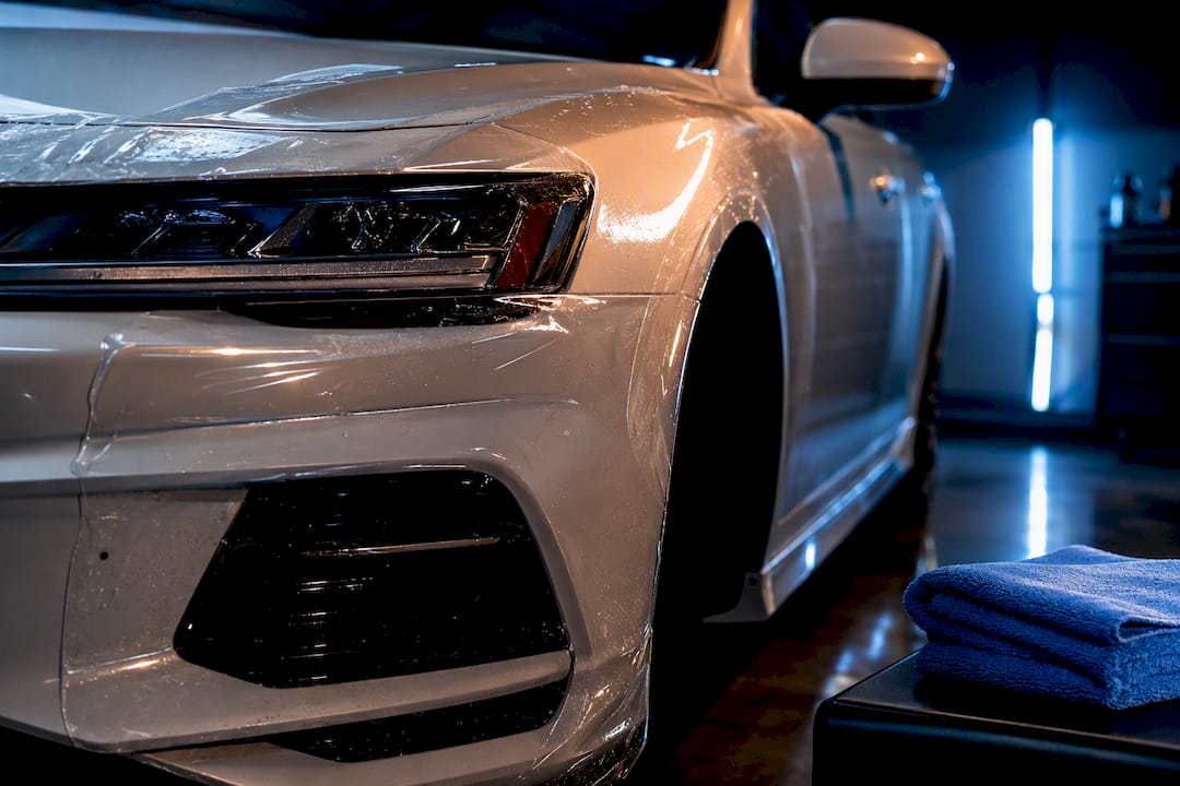 Paint protection film covering a vehicle front corner